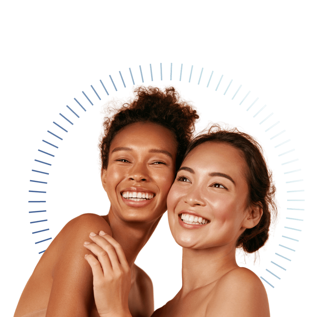 Two people smiling, standing close together against a transparent background. A semicircular design of lines above them adds a decorative touch. Both have radiant skin and are embracing joyfully.